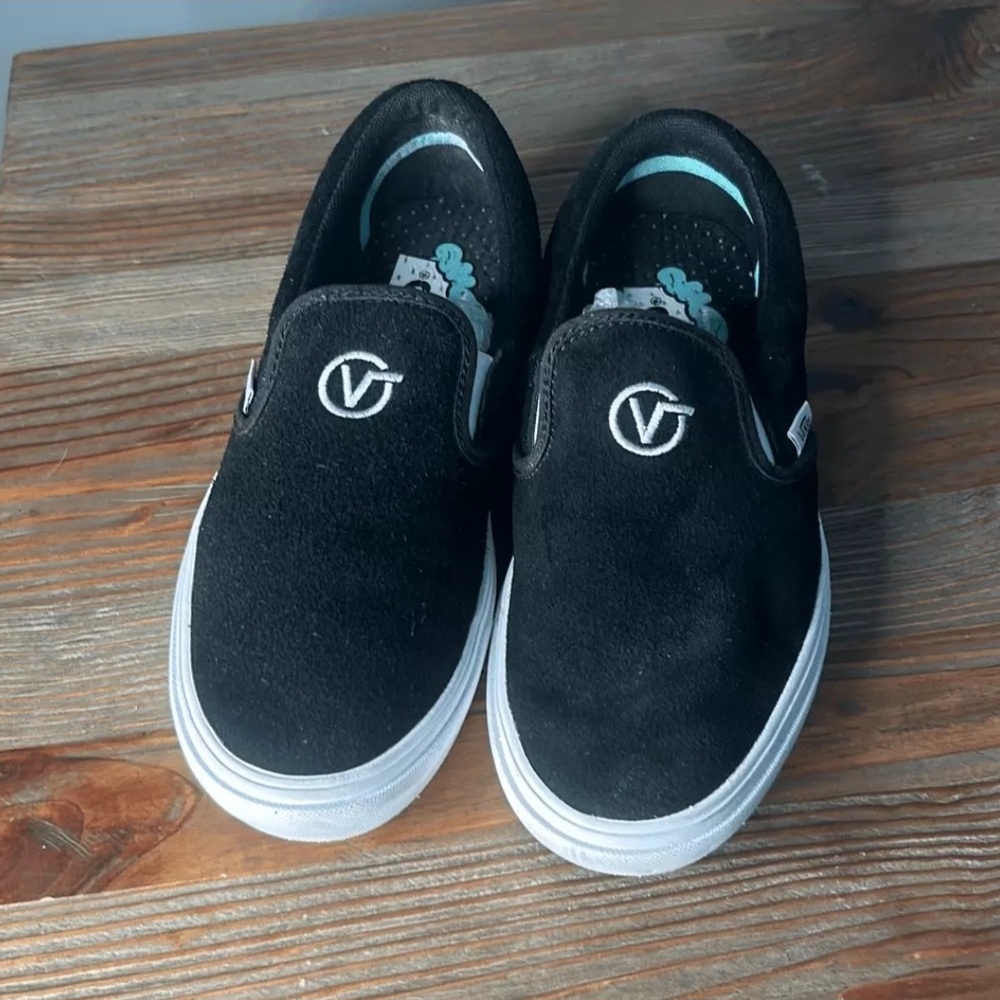 Vans Womens 7 Black and White Slip-On Sneakers
